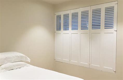 Solid panel shutters work best in a bedroom as they do block out the most light of any style of shutter. Custom Made Frameless Fixed Solid Panel Shutters Prahran ...