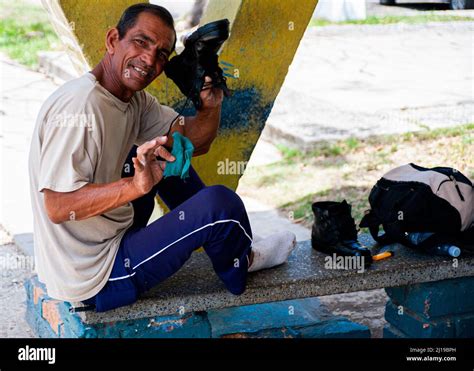 Cuban Man Polishing His Boots In Havana Cuba Stock Photo Alamy