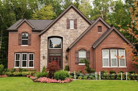 Suburban Home With Brick And Stone Combination Facade