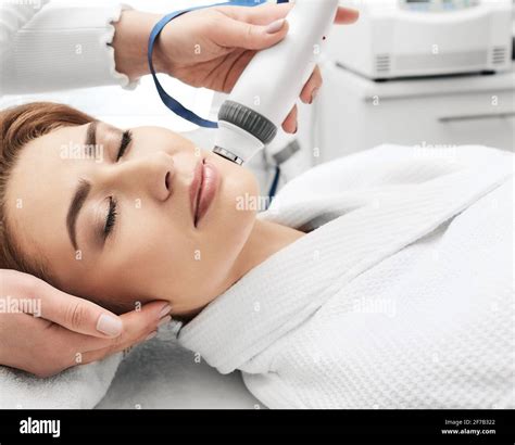 Adult Woman During Rf Lifting Face Skin Tightening With Her Beautician