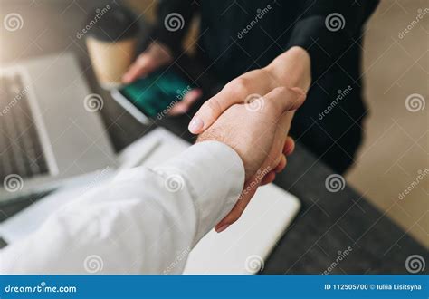Close Up Of Handshake Of Businessman And Businesswoman Man S Hand