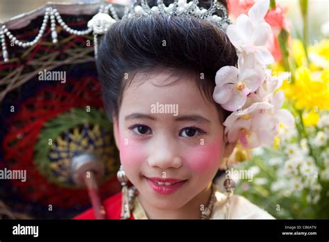 Thailand Chiang Mai Portrait Of Girl In Traditional Thai Costume At The Chiang Mai Flower
