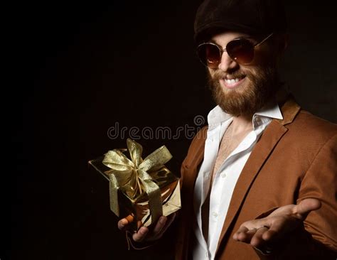 Brutal Man With Beard And Mustache With Gold Present T For Birthday Or Christmas Open Palm