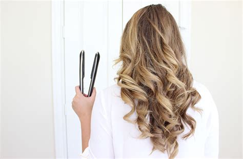 Rather than finishing off your curly ponytail with a braid, switch it up by braiding your hairline into four sleek dutch braids and tying them into a loose and low ponytail. How to curl your hair with a flat iron...the easy way!