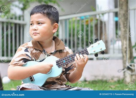 Boy Playing The Ukulele Stock Image Image Of Expression 32543773