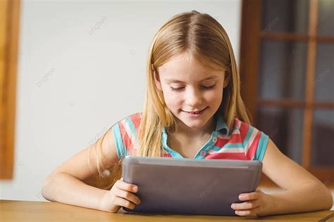 Cute Pupil In Class Using Tablet Pc Classroom Touching Elementary School Photo Background And