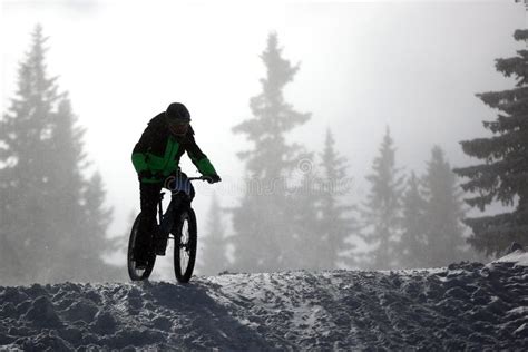 Cyclist Extreme Riding Mountain Bicycle In Snow Stock Photo Image Of