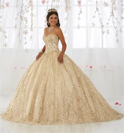 look picture perfect in this gold appliqued long strapless dress with a line skirt by house of