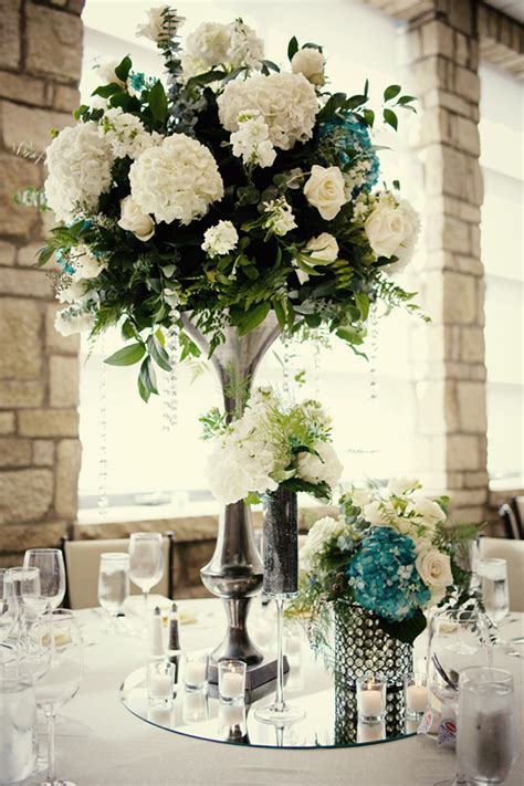 elegant wedding reception centerpieces ivory hydrangeas teal accents