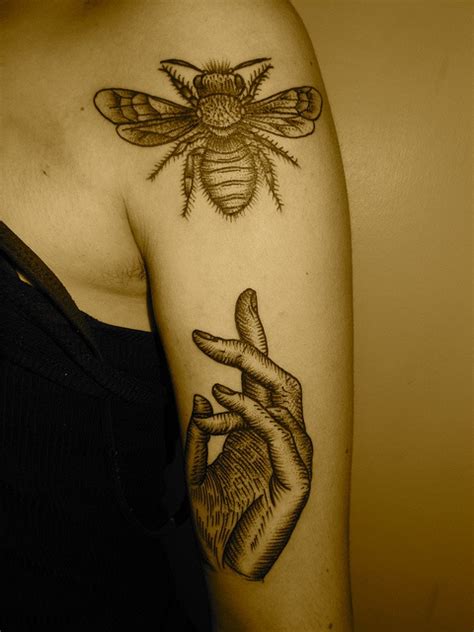 Black Hand And Bee Tattoo On Arm
