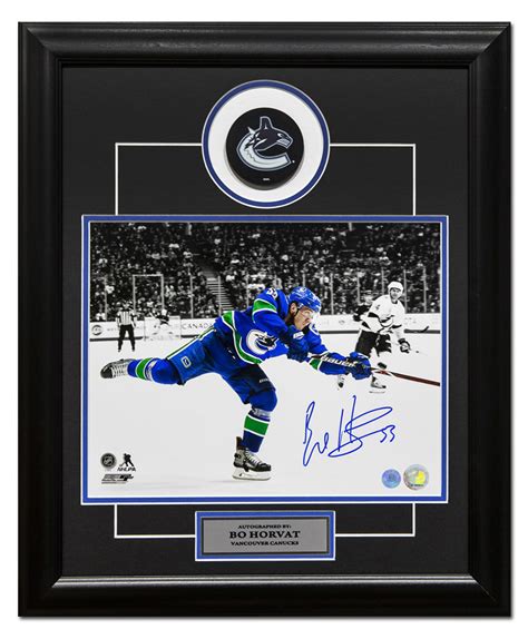 bo horvat vacouver canucks autographed sniper spotlight 20x24 puck frame nhl auctions
