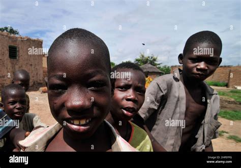 Burkinabe Children Smiling At The Camera In A Small Village In Central