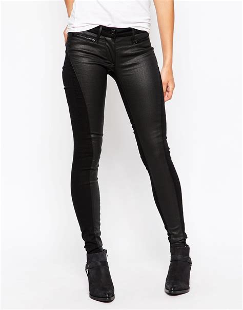 lyst 3x1 low rise coated skinny jeans in black