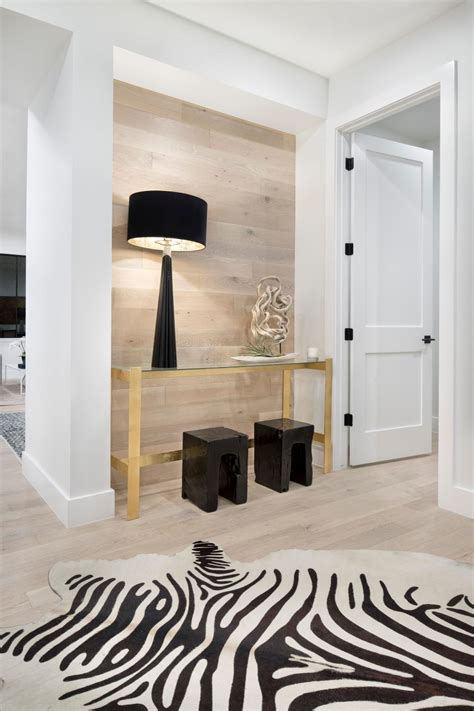 Modern Farmhouse Foyer With Wood Accent Wall And Black And