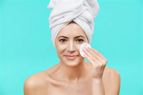 Smiling Mid Adult Woman Removing Make Up Using A Cotton Pad Beauty And Skincare Concept Stock