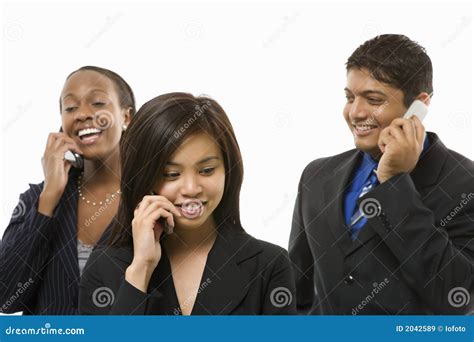 Businesswomen And Businessman Talking On Cell Phones Stock Image