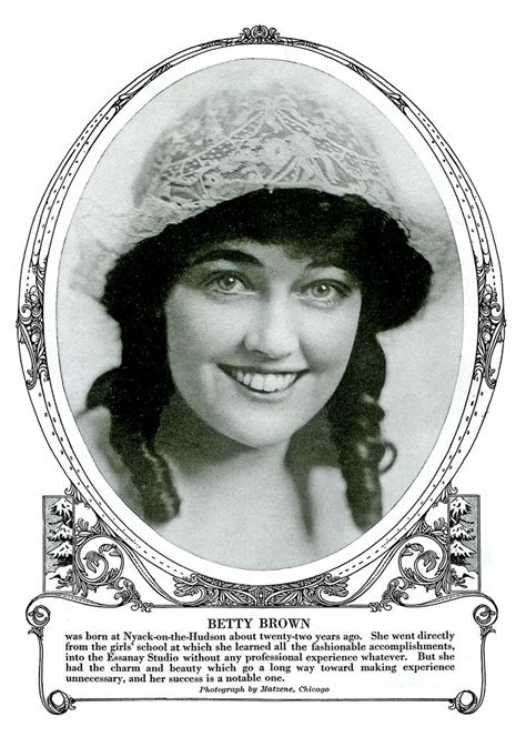 An Old Photo Of A Woman Wearing A Hat