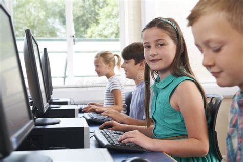 Group Of Elementary School Children In Computer Class Stock Photo