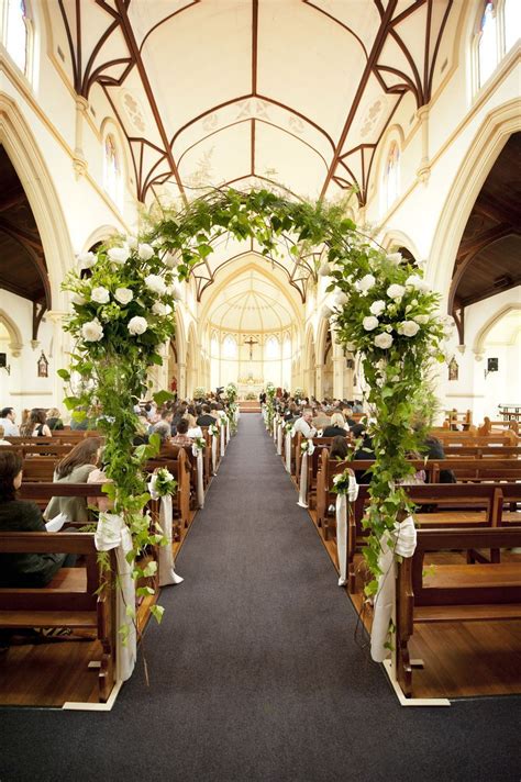 Decorate the sides of the aisles with candles. A Floral Arch IN the church - love this wedding ceremony ...