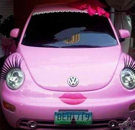 pink volkswagen beetle convertible with eyelashes