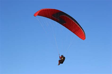 Red Parachute Photograph By Radoslav Nedelchev Fine Art America