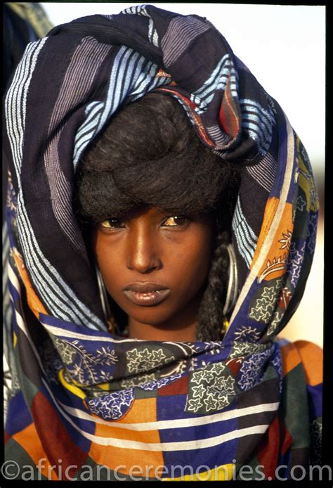 Africa | A Wodaabe woman veiled in colorful scarves by ... | African ...