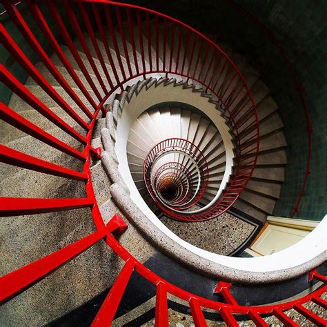 The palm court features a red spiral staircase, a jacuzzi, and a palm tree. Red Spiral Stairs - Modern Artwork | Spiral stairs, Round stairs, Stairs design