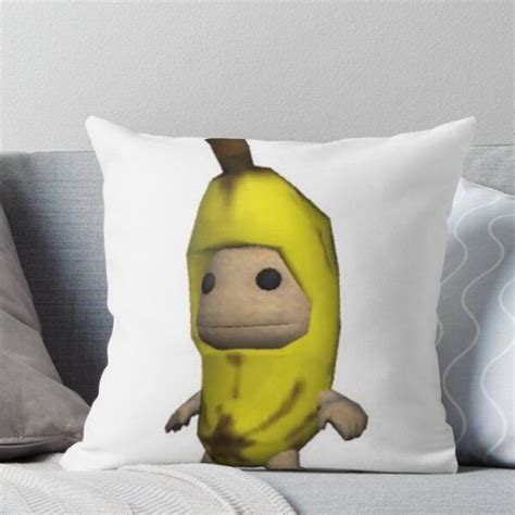 A Cartoon Banana With An Angry Expression On Its Face Throw Pillow By