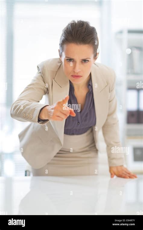 Concerned Business Woman Pointing In Camera Stock Photo Alamy
