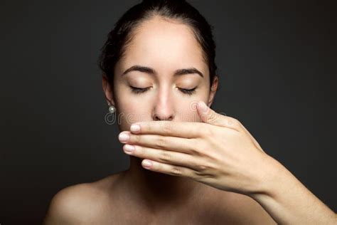 Beautiful Young Woman Covering Her Mouth With Hand Isolated Stock