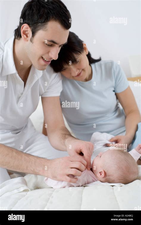 Parents Changing Babys Diaper Stock Photo Alamy