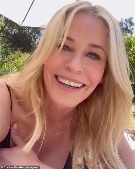 Chelsea Handler Reclines Naked On Pool Inflatable Wrapped In Rainbow Flag To Celebrate Pride