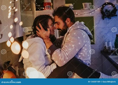 Couple Hugging In The Kitchen On Christmas Eve Stock Image Image Of