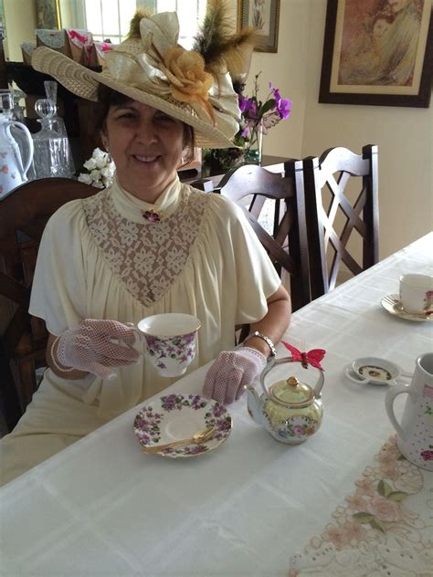 A Lady Dressed Up As Downton Abbey Attire For An Afternoon Tea Party