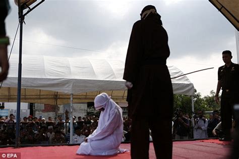 Indonesian Woman Caned In Front Of Cheering Onlookers For Having Sex Outside Of Marriage