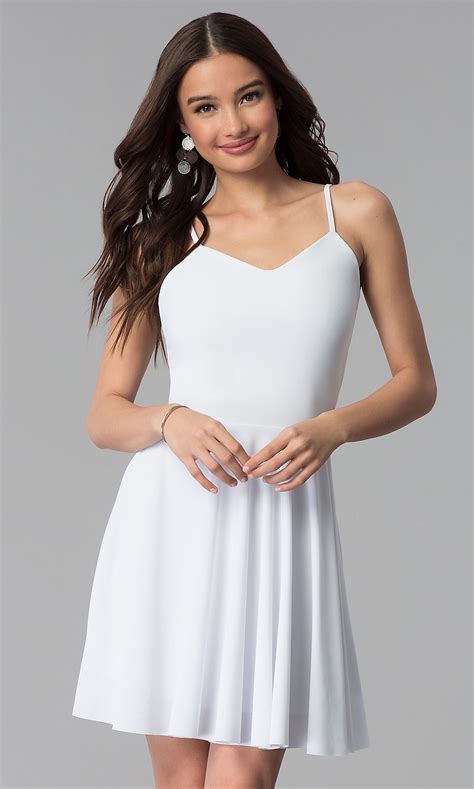 This celena mini dress is a perfect choice for graduation season because it's simple and affordable but looks incredibly luxe. V-Neck Short Caged-Back White Graduation Dress