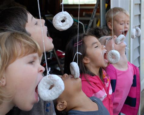 Happy Donut Day! Tie powdered donuts on a string in your ...