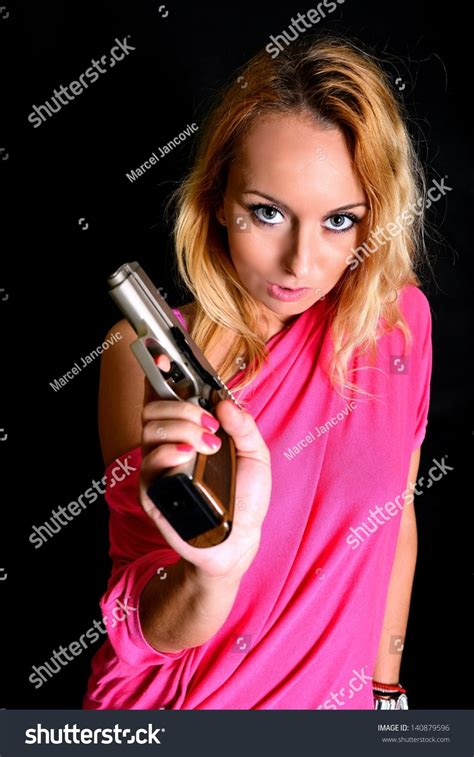 Sexy Woman Holding Gun Stock Photo 140879596 Shutterstock