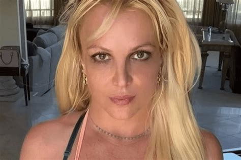 In A Plunging Dress Britney Spears Showcases Her Iconic Curves