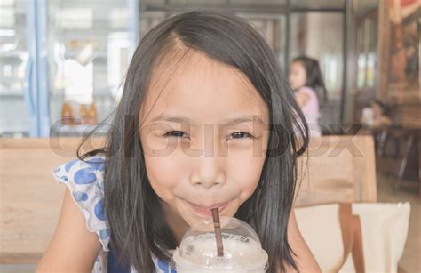 asian girl drinking water stock image colourbox