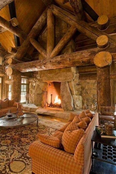 A Living Room With Couches And A Fire Place In The Middle Of The Room