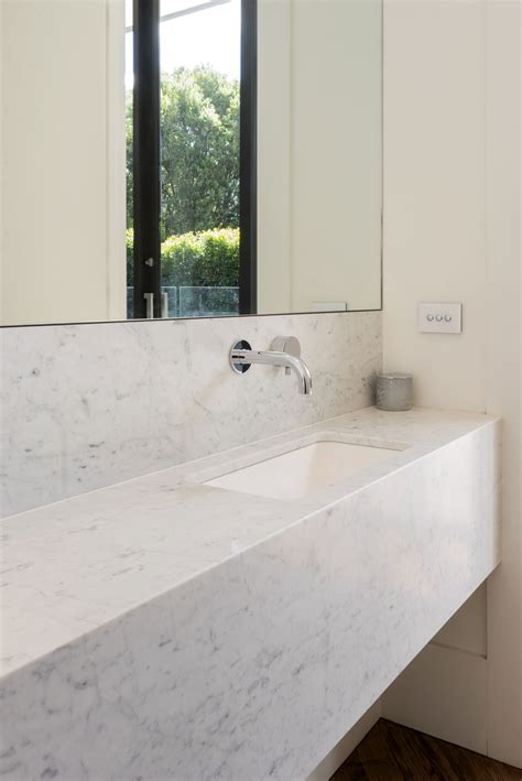 Serene Carrara Marble Powder Room Beautiful In Its Simplicity 📷