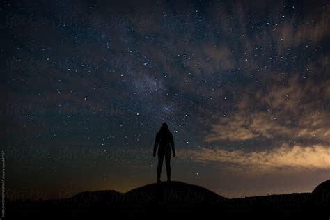 Female Silhouette Against Night Sky And Milky Way Stocksy United