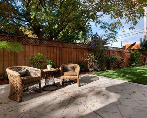 Build a patio bench from wooden pillars and cinder blocks, which comes with cute lighting and planters. Backyard Fence | Houzz