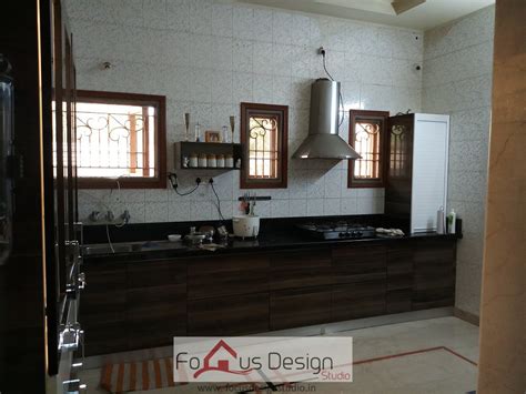 Brown Modular Kitchen With Chimney Interior Focus Design Studio