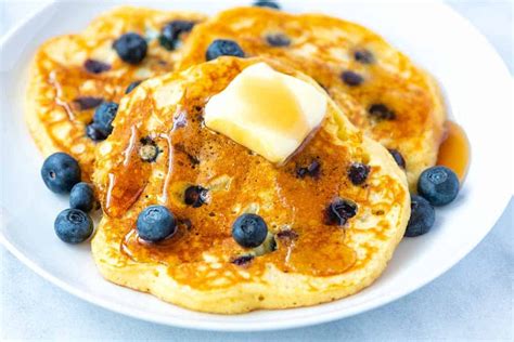 Time To Celebratenational Blueberry Pancake Day The Delightful Laugh