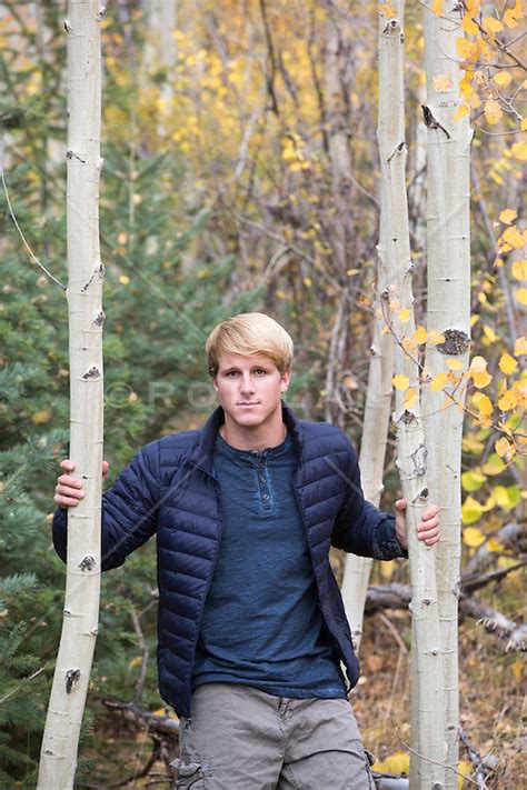 Handsome Rugged Man Outdoors In The Woods During The Fall Season Rob