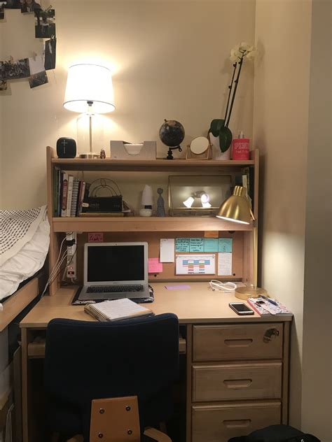 This College Dorm Room Desk Is Asymmetrical Because Of The Blue Chair