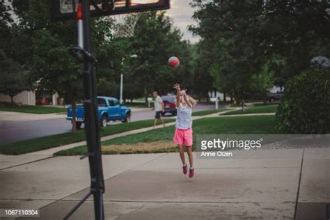 Kids Playing Basketball In Driveway Photos And Premium High Res