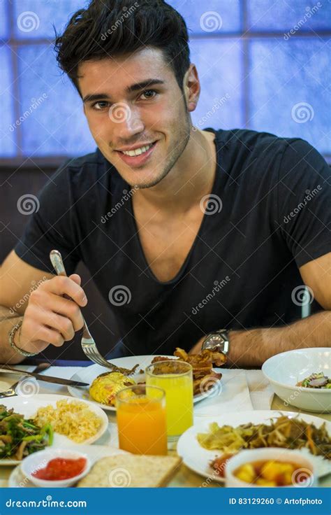 Attractive Young Man Eating Breakfast Stock Photo Image Of Hand Male